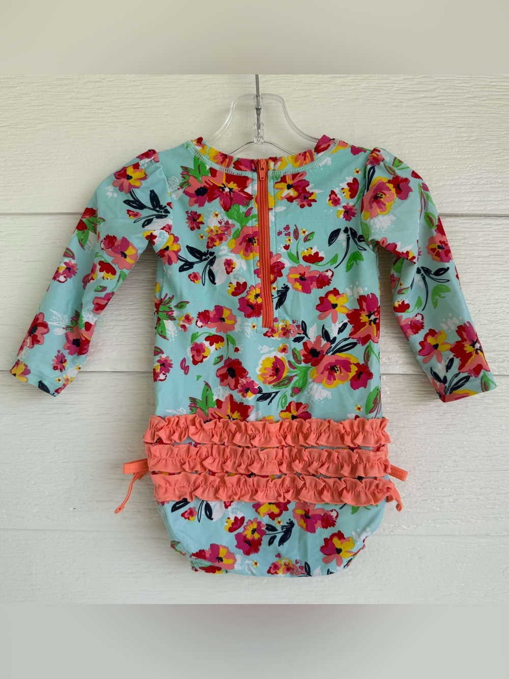 RuffleButts 12-18M Colorful Aqua Floral Long-Sleeve One-Piece with Coral Ruffles